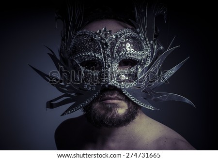 Treasure, jewels and silver. Man with mask of precious metals
