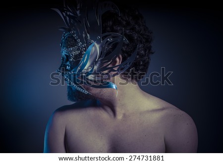 Party, bearded man with silver mask Venetian style. Mystery and renaissance