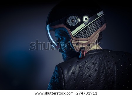 Travel, biker with motorcycle helmet and black leather jacket, metal studs