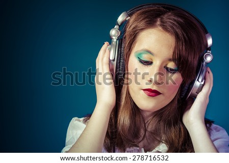 Joyful, Teen, redhead teenager listening to rock music headphones
