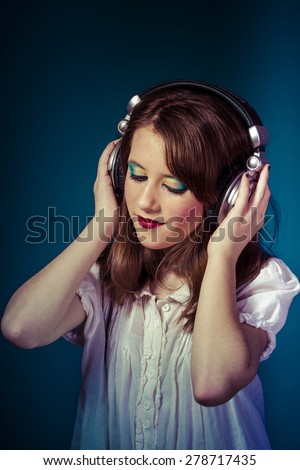 Joyful, Teen, redhead teenager listening to rock music headphones