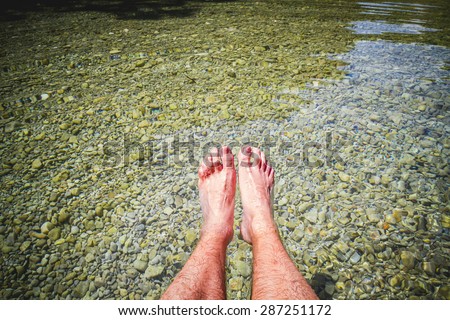feet in summer by the water of a river in an inland lake