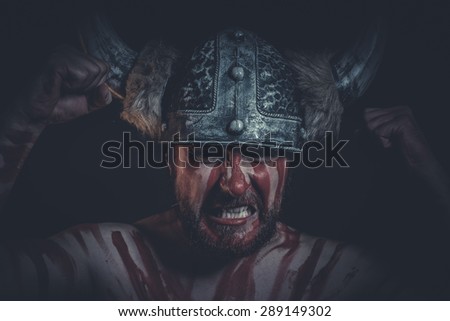 Fear, Viking warrior with a horned helmet and war paint on his face