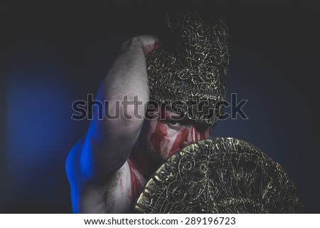 Magic, bearded man warrior with metal helmet and shield, wild Viking