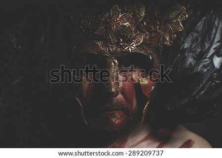 Mythology, bearded man warrior with metal helmet and shield, wild Viking