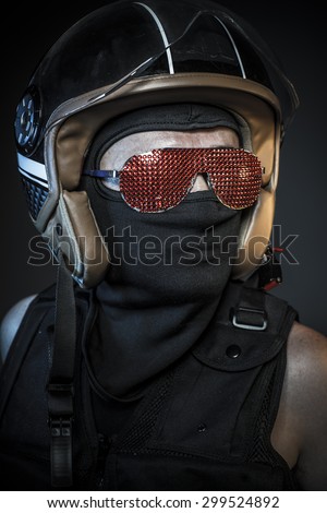 Modern biker with sunglasses red crystals and balaclava