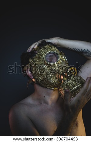 apocalypse, depression and danger man with golden gas mask