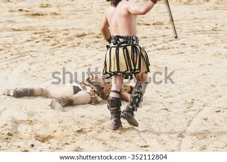 Killing, gladiator fighting in the arena of Roman circus