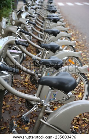 PARIS, FRANCE - NOVEMBER 22, 2014: A row of rental bicycles for hire, called Velib, in Paris
