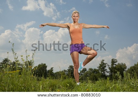 blonde girl in nature green park, fitness program