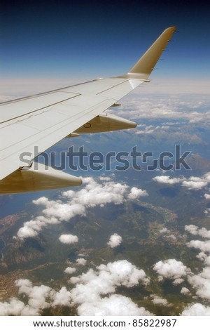 Wing seen from inside of a plane during a flight.