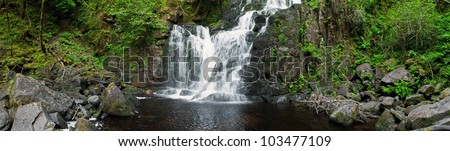 stunning Torc waterfall in the Killarney National Park, Ireland (panoramic picture with 180 angle view)