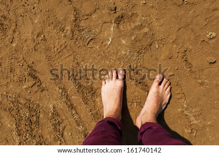 young man barefoot on a beach in Weston-super-Mare, United Kingdom