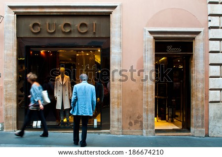 ROME - SEPTEMBER 18: unidentified man looking at Gucci show window at Via dei Condotti in Rome, Italy on September 18, 2013. As per Forbes 2013 list Gucci was ranked 38 most valuable brand.