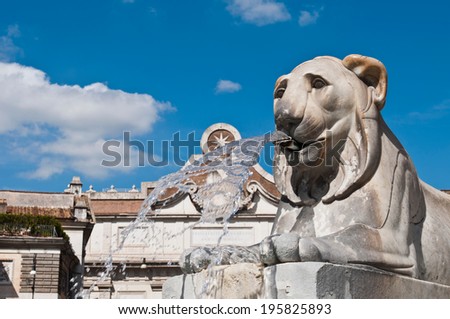 one of the four Egyptian lion statues at the base of the Obelisk fountain in Piazza del Popolo (Peoples Square) in Rome, Italy