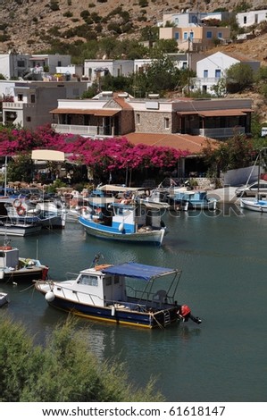 beautiful greek island in Kalymnos, Greece (port, houses and flowers)