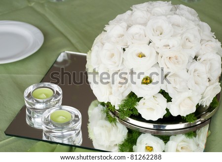 stock photo detail of a wedding table with estomas flowers arrangement and