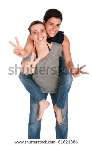 happy smiling sisters showing victory hand sign while playing together piggyback, isolated on white background