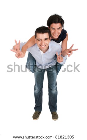 happy smiling brother and sister showing victory hand sign while playing together piggyback (full length picture, isolated on white background)