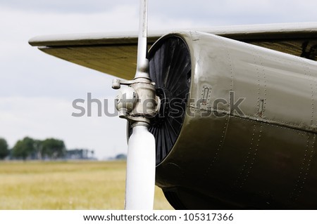 Private propeller-driven airplane over blurry background