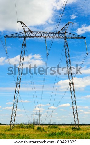Electricity pylon of high voltage line in green field
