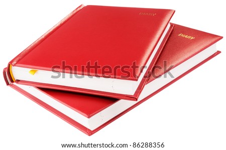 Two red paper personal organizers isolated on the white