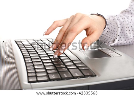Close-up of male fingers typing a document on the laptop