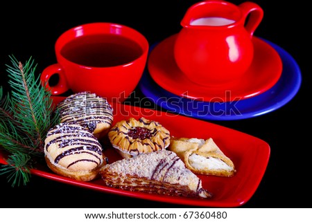 A tray of tea with milk, sugar and biscuits