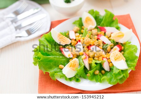 Salad with eggs, crab sticks and corn