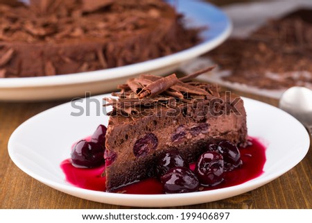 Chocolate mousse cake with dark cherries
