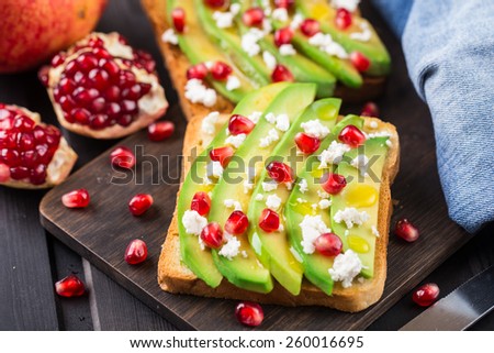Avocado sandwich with feta and pomegranate