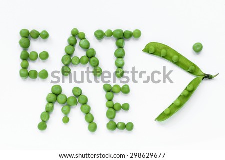 Eat me: inscription green peas isolated on a white background