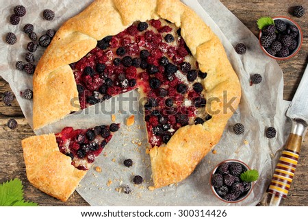 Summer pie with fresh berries of black raspberries Cumberland