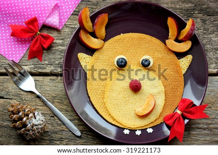 Funny Christmas breakfast of pancakes in the form of a deer