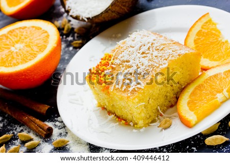 Basbousa (Namoora) - Egyptian semolina cake with orange sugar syrup and spices selective focus