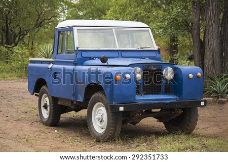 Hwange National Park, Zimbabwe - 05 April 2015: Land Rover old model 4 WD vehicle in Hwange National Park of Zimbabwe. Vintage car style.