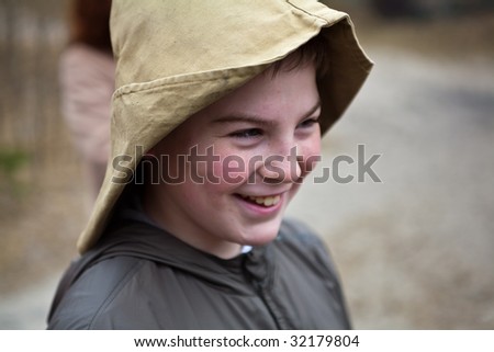 Portrait of young smiling boy with fisherman\'s hat