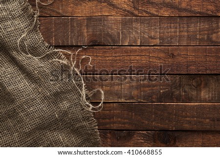 Burlap texture on wooden table background. Wooden table with sacking