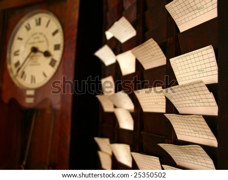 It is an old school time clock with cards and a classic grandfather clock.