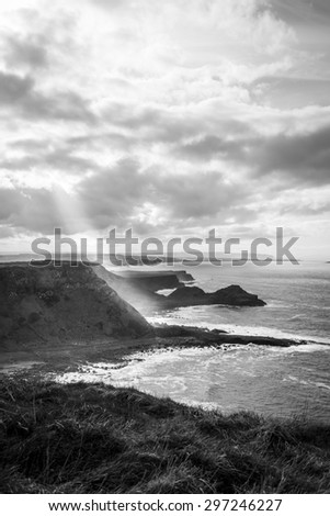 Overlooking Giants Causeway with a Ray of Sunshine hitting a cliff face