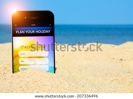 mobile phone with holiday planner on the beach