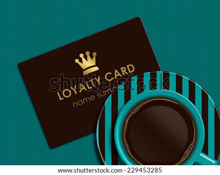 cup of coffee with loyalty card lying on tablecloth