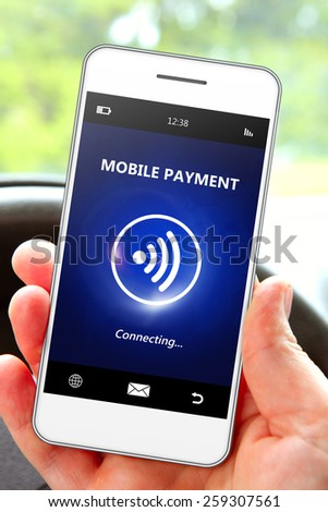 hand holding mobile phone with mobile payment. focus on phone
