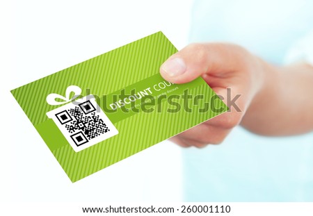 hand holding spring discount card isolated over white background