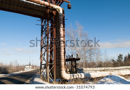 Pipes of a hot heat supply crossing the automain road Irkutsk-Krasnoyarsk.