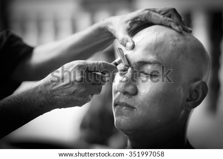 Bangkok,THAILAND FEBRUARY 01 : Male who will be monk cut hair for be Ordained. Thailand on February 01 , 2015