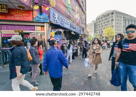 SEOUL, SOUTH KOREA - CIRCA APRIL 2014: Young people go for a budget shopping in Dongdaemun district in Seoul circa April 2014
