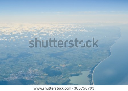 EUROPE - CIRCA 2011: Aerial view of the ocean and land coast from the sky
