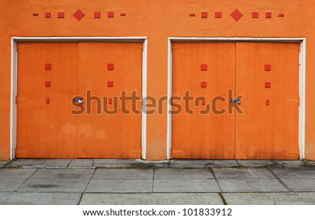 Pair of 1950\'s style orange wood painted garage doors