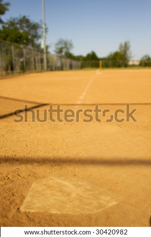 short depth of field shot of home plate looking towards third base